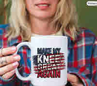 Woman in flannel shirt holding a white ceramic mug with bold text that reads “Make My Knee Great Again,” designed with a distressed American flag background—funny aging or boomer gift idea.