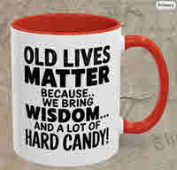 Funny two-tone accent mug with red handle and interior, featuring bold black text: “Old Lives Matter Because We Bring Wisdom and a Lot of Hard Candy