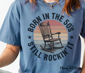 	Blue Jean birthday shirt with a rocking chair graphic and the words “Born in the 50s, still rockin’ it.”